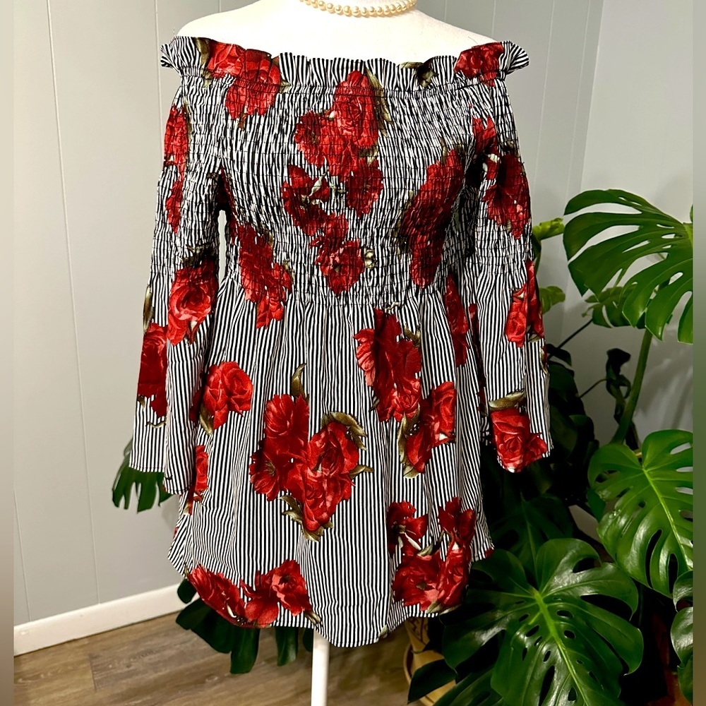 #8)  mileage shoulder off  floral top with stretch chest size medium excellent.